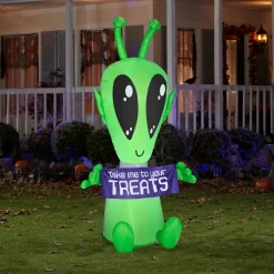 New National Tree Company 7 ft. Halloween Alien with Sign Inflatable Decoration with LED Lights