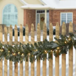 New National Tree Company 9 ft. Pre-Lit Frosted Arctic Spruce Garland with Clear Lights