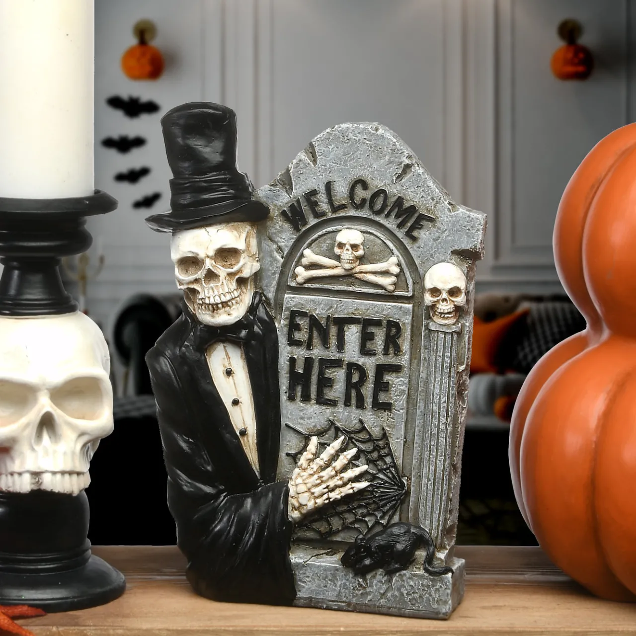 National Tree Company 12 in. Halloween Skeleton Holding a Tombstone Decoration