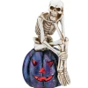 New National Tree Company 11 in. Halloween Skeleton Resting on a Purple Galaxy Jack O Lantern