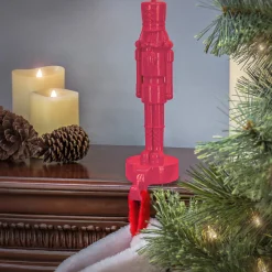 New National Tree Company 10 in. HGTV Home Collection Resin Nut Cracker- Pink Stocking Holder