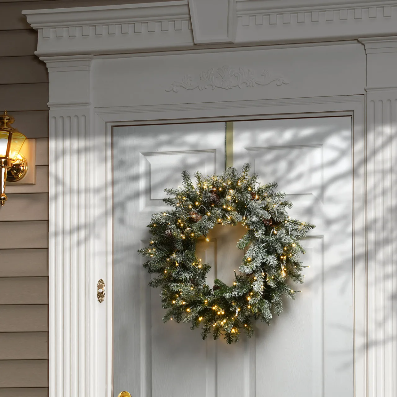 National Tree Company 24 in. Pre-Lit Snowy Morgan Spruce Wreath with Dual Color LED Lights